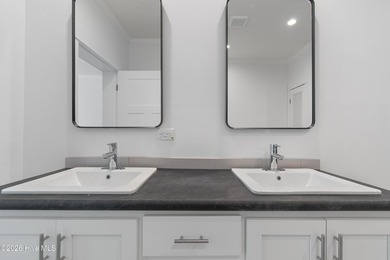 The spacious kitchen is a standout feature, offering a large - photo 12