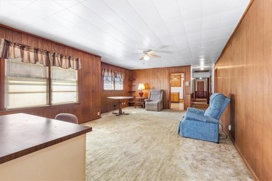 Discover the potential of this beautiful four-sided brick ranch