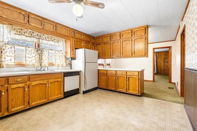 Discover the potential of this beautiful four-sided brick ranch