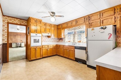 Discover the potential of this beautiful four-sided brick ranch