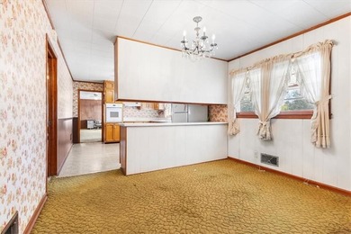 Discover the potential of this beautiful four-sided brick ranch