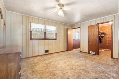 Discover the potential of this beautiful four-sided brick ranch