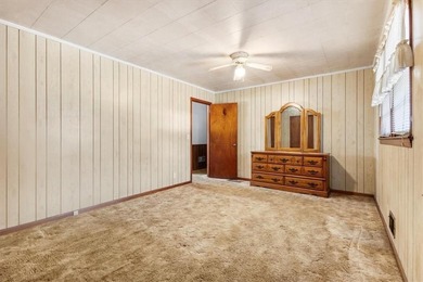 Discover the potential of this beautiful four-sided brick ranch