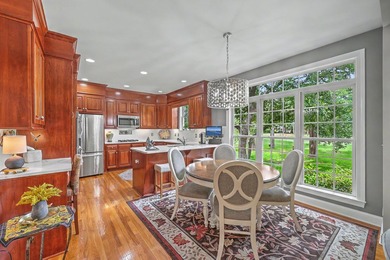 This stunning custom-built brick home in the prestigious gated - photo 16