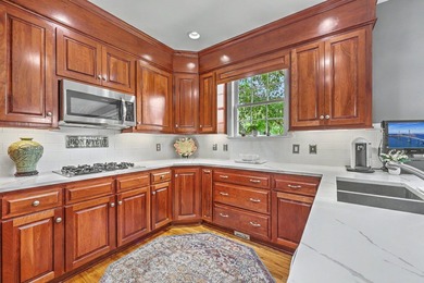 This stunning custom-built brick home in the prestigious gated - photo 18