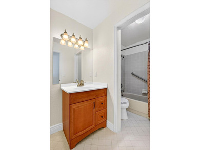 STUNNING LAKESIDE RENOVATION! 1st-floor condo offers expansive - photo 13