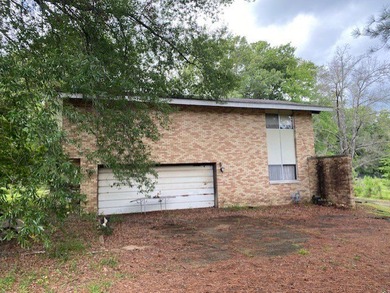 This brick home with 5 bedrooms and 3.5 baths with a double - photo 3