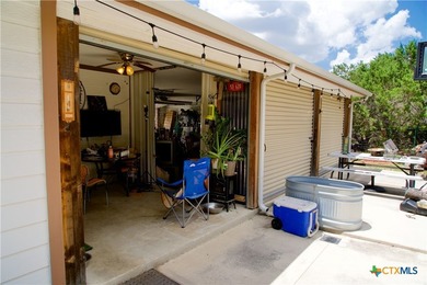 Nestled on a half-acre wooded lot in Rocky Creek Ranch, this - photo 11