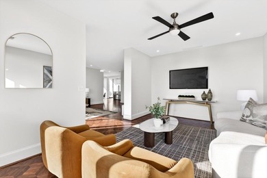 Originally configured as a three-bedroom, three-bath plan, this