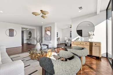 Originally configured as a three-bedroom, three-bath plan, this