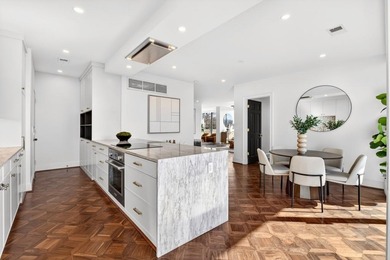 Originally configured as a three-bedroom, three-bath plan, this