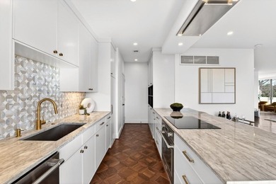 Originally configured as a three-bedroom, three-bath plan, this