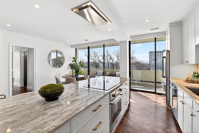 Originally configured as a three-bedroom, three-bath plan, this