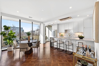 Originally configured as a three-bedroom, three-bath plan, this