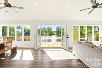 Wake up to breathtaking waterfront views in this beautifully - photo 1