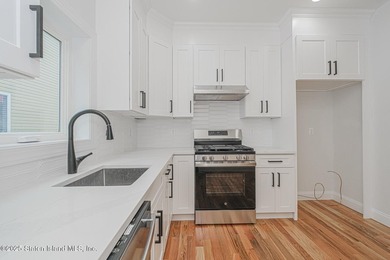 NEW CONSTRUCTION! Beautiful TWO family custom 6 over 6 home - photo 18
