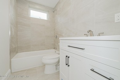 NEW CONSTRUCTION! Beautiful TWO family custom 6 over 6 home - photo 28