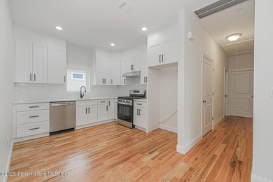 NEW CONSTRUCTION! Beautiful TWO family custom 6 over 6 home - photo 41