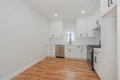 NEW CONSTRUCTION! Beautiful TWO family custom 6 over 6 home - photo 42