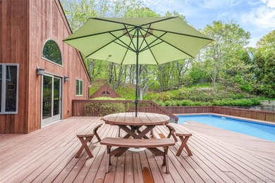 Set within the quiet Rolling Woods neighborhood on a shy acre at - photo 11
