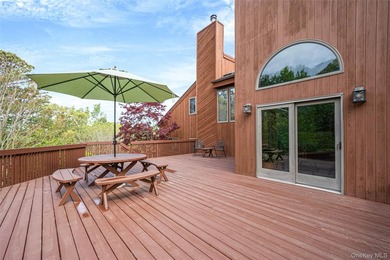 Set within the quiet Rolling Woods neighborhood on a shy acre at - photo 12