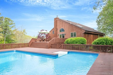 Set within the quiet Rolling Woods neighborhood on a shy acre at - photo 13