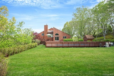 Set within the quiet Rolling Woods neighborhood on a shy acre at - photo 15