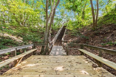 Set within the quiet Rolling Woods neighborhood on a shy acre at - photo 47