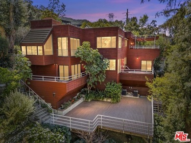 Built in 1980, this architectural gem showcases many of the - photo 1