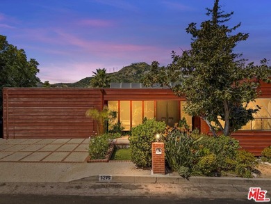 Built in 1980, this architectural gem showcases many of the - photo 2