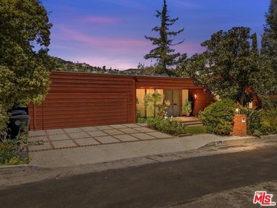 Built in 1980, this architectural gem showcases many of the - photo 3