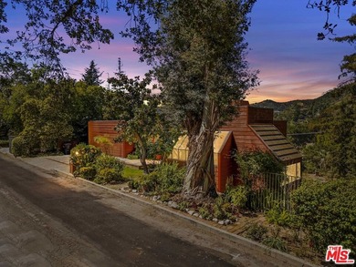 Built in 1980, this architectural gem showcases many of the - photo 4