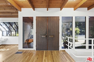 Built in 1980, this architectural gem showcases many of the - photo 6