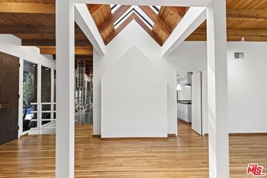 Built in 1980, this architectural gem showcases many of the - photo 7