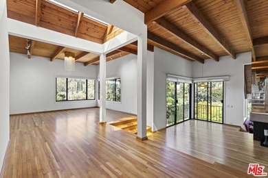 Built in 1980, this architectural gem showcases many of the - photo 9