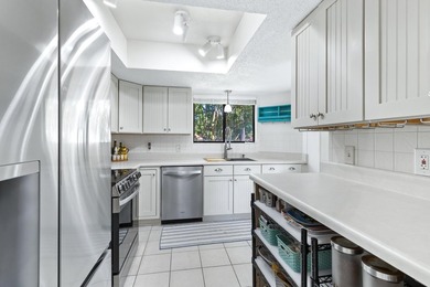 Nestled on the pond in the sought-after Fairways community of