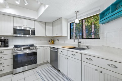 Nestled on the pond in the sought-after Fairways community of