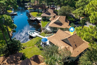 Nestled on the pond in the sought-after Fairways community of