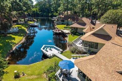 Nestled on the pond in the sought-after Fairways community of