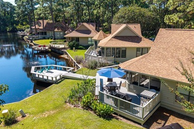 Nestled on the pond in the sought-after Fairways community of