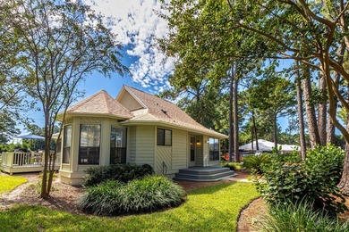 Nestled on the pond in the sought-after Fairways community of