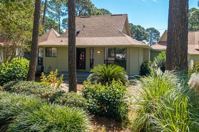 Nestled on the pond in the sought-after Fairways community of