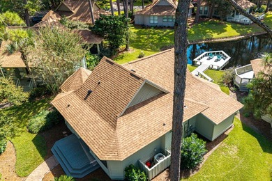 Nestled on the pond in the sought-after Fairways community of