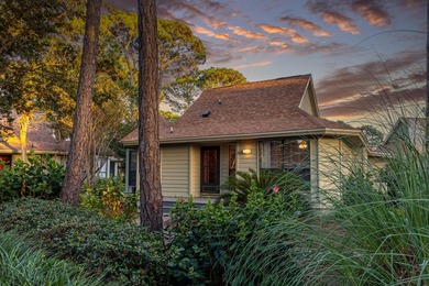 Nestled on the pond in the sought-after Fairways community of