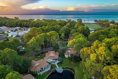 Nestled on the pond in the sought-after Fairways community of