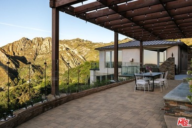 Perched on a private promontory deep within the Santa Monica - photo 21