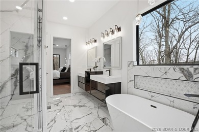 Welcome to your new modern retreat in Porto Cima. This stunning - photo 13