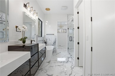 Welcome to your new modern retreat in Porto Cima. This stunning - photo 14