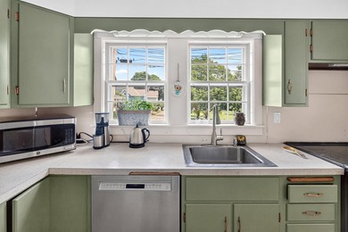 Mid-Century Ranch and Modern Convenience! Nestled within the - photo 7