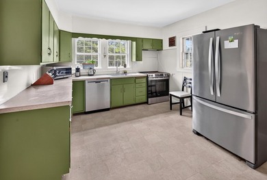 Mid-Century Ranch and Modern Convenience! Nestled within the - photo 8